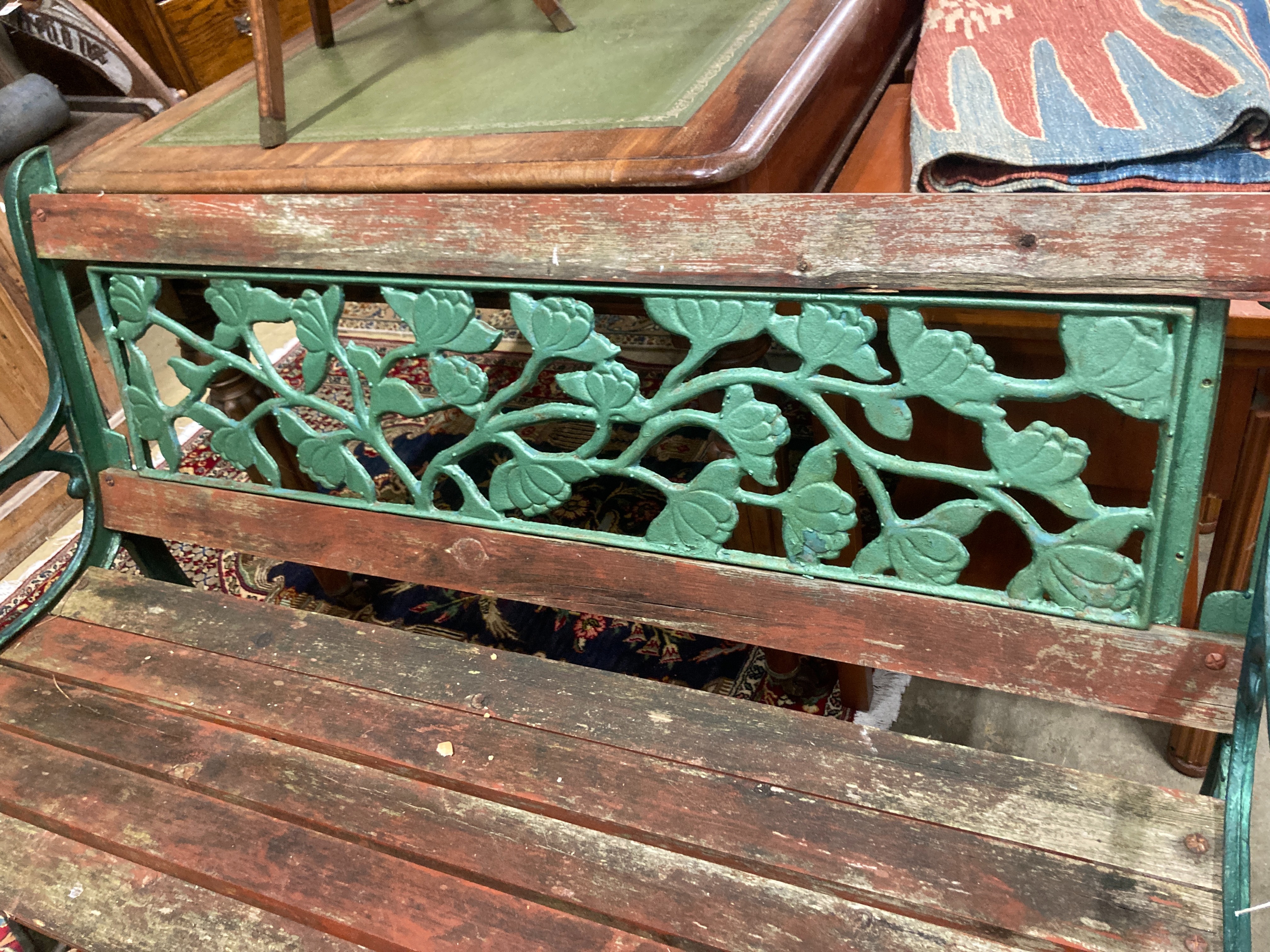 A cast iron and wood garden bench